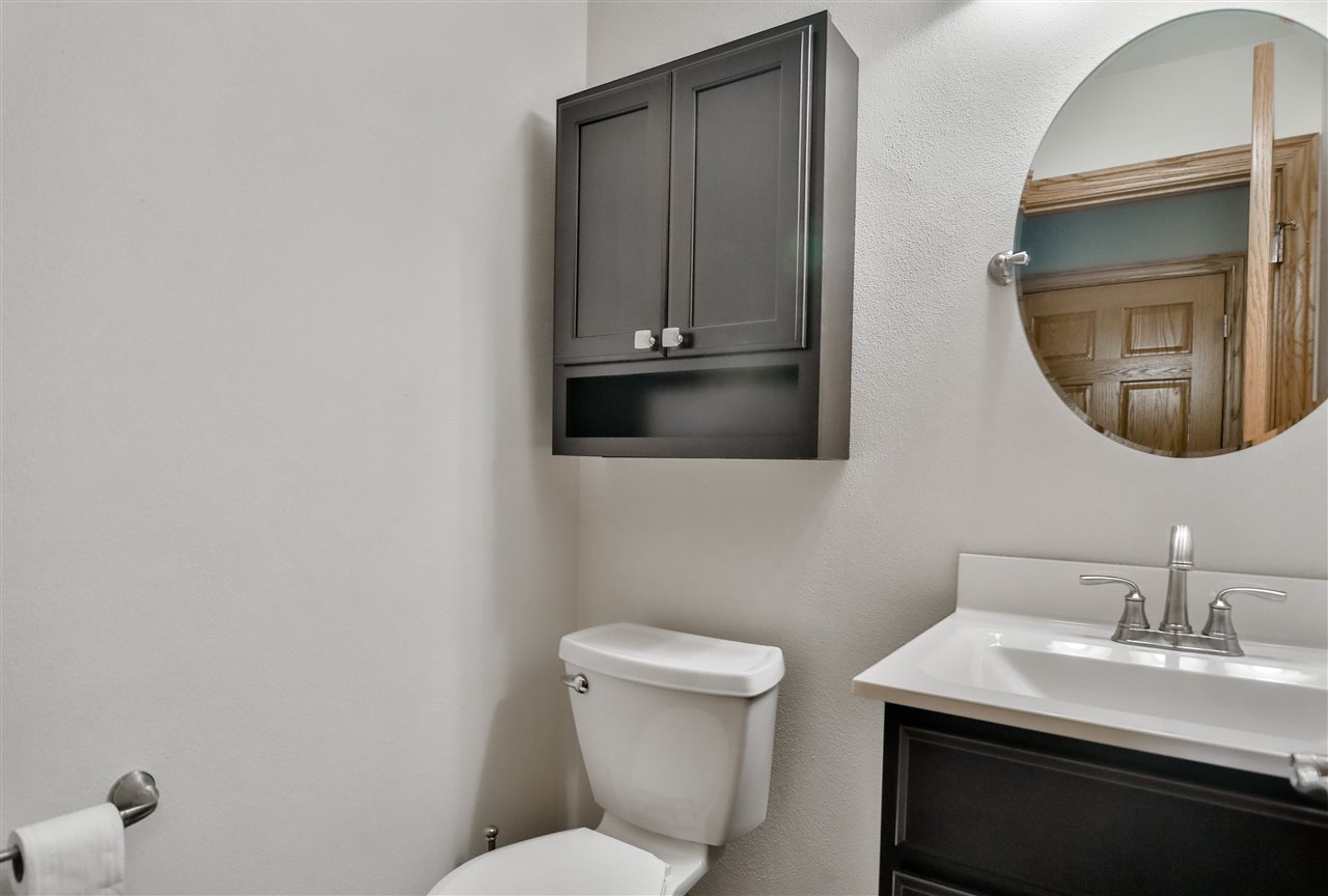 693 Bayfield Road Rockton, IL 61073 - Photo 24 of 26 a bathroom with a toilet sink and mirror