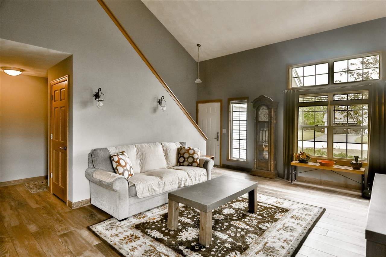 693 Bayfield Road Rockton, IL 61073 - Photo 5 of 26 a living room with furniture and a window