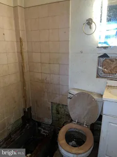 a bathroom with a toilet and a sink