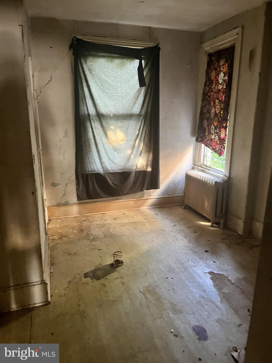 2736 North 24th Street Philadelphia, PA 19132 - Photo 3 of 14 a view of a livingroom with wooden floor and a window