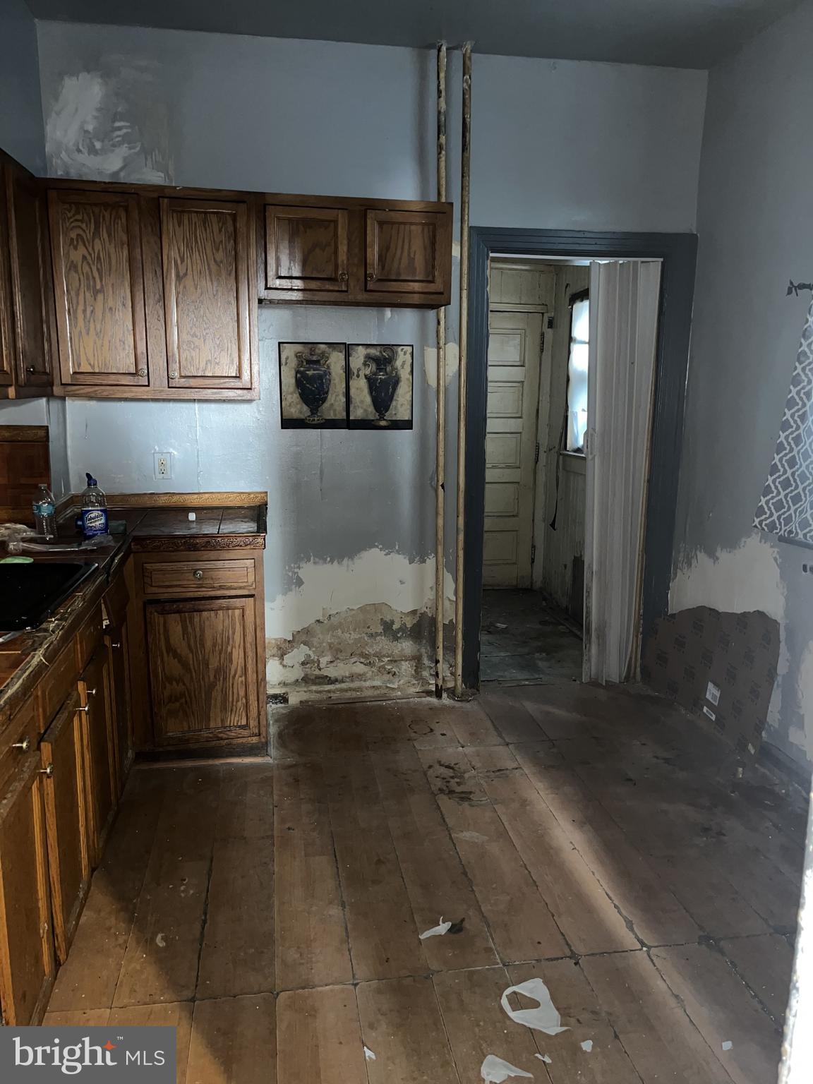 2736 North 24th Street Philadelphia, PA 19132 - Photo 9 of 14 a kitchen with a refrigerator and a stove