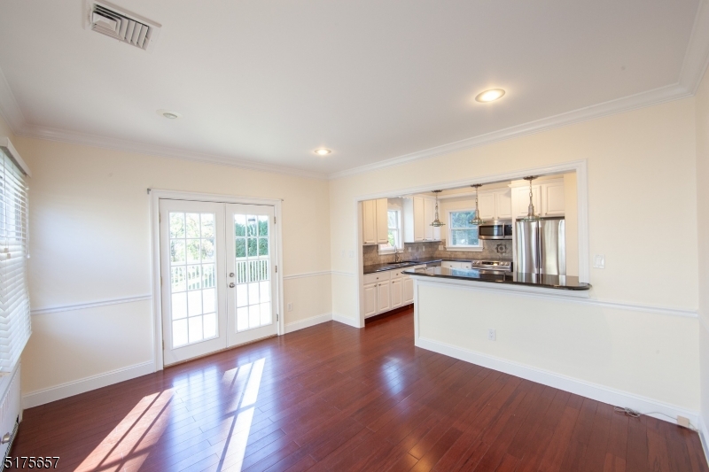 16 Columbus Avenue Glen Ridge, NJ 07028 - Photo 14 of 14 a living room with stainless steel appliances kitchen island wooden floor and large window