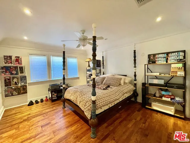 a bedroom with a bed and dresser