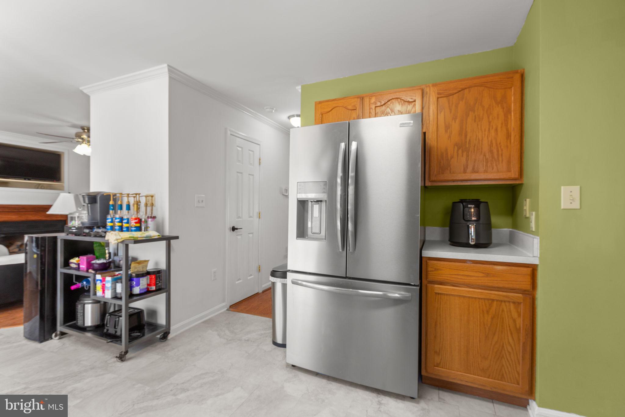 3421 Lancaster Ring Road Fredericksburg, VA 22408 - Photo 13 of 45 Kitchen into foyer hallway offers a half bath