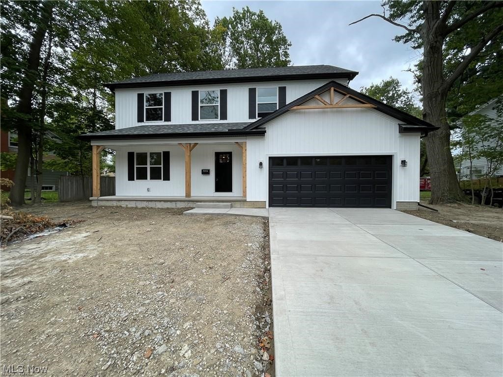 7374 Crossfield Road Mentor, OH 44060 - Photo 11 of 35 View of front of property with garage and a porch