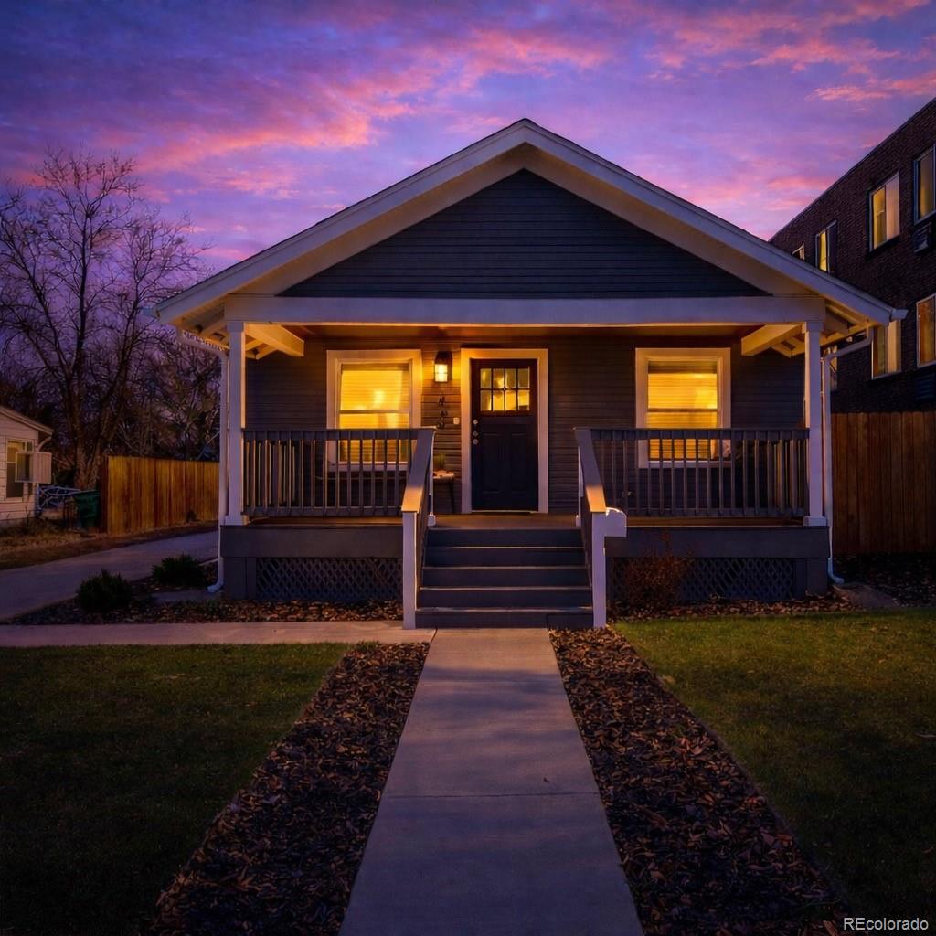 1620 Galena Street Aurora, CO 80010 - Photo 2 of 34 a view of a house with a small yard and wooden floor and fence