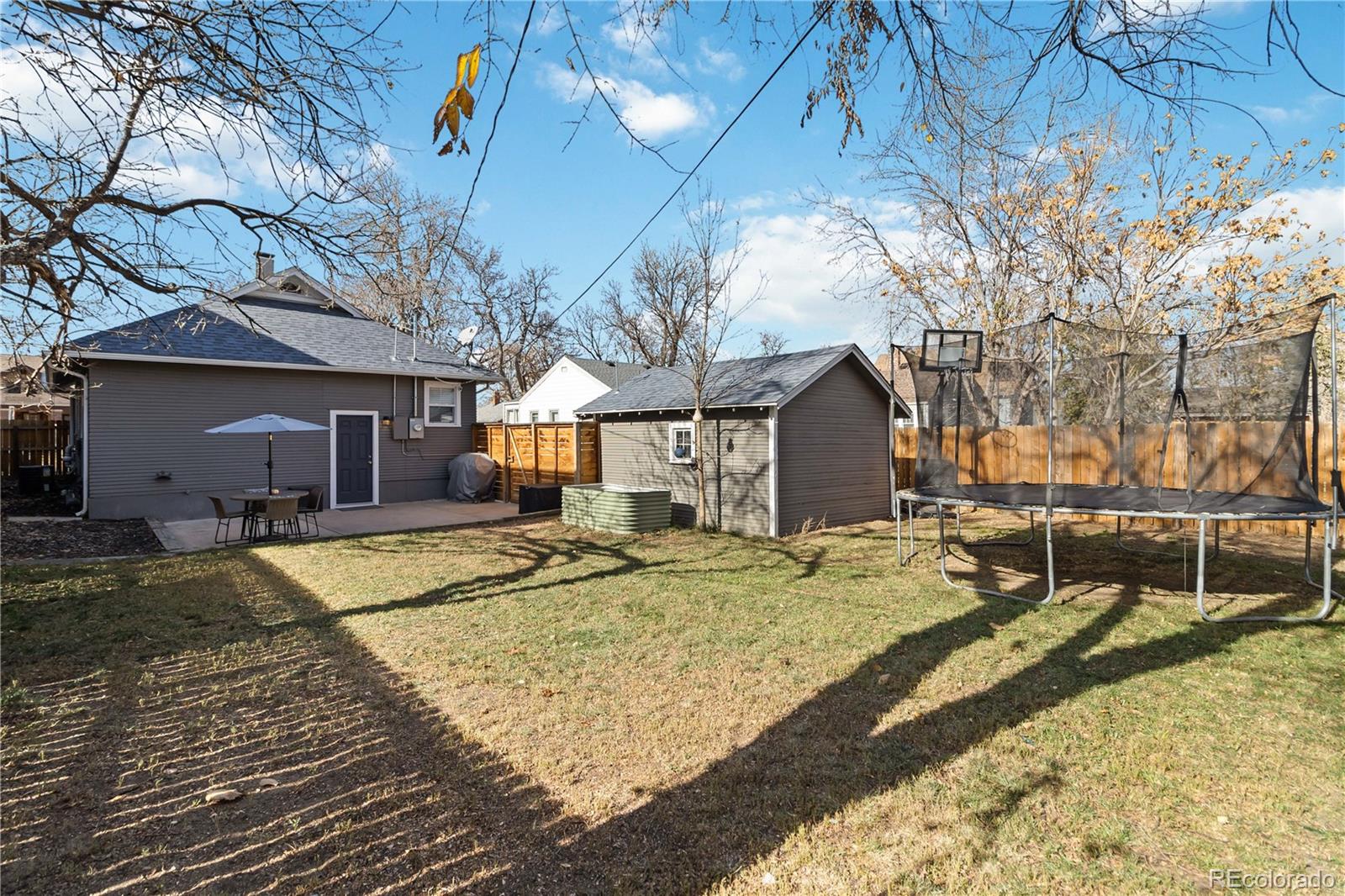 1620 Galena Street Aurora, CO 80010 - Photo 25 of 34 a view of a house with snow on the side of the road