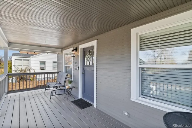 a view of a porch with wooden floor