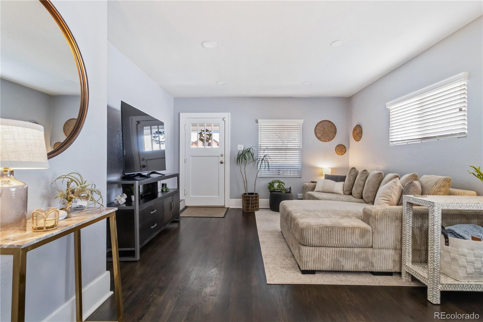 1620 Galena Street Aurora, CO 80010 - Photo 6 of 31 a living room with furniture window and wooden floor