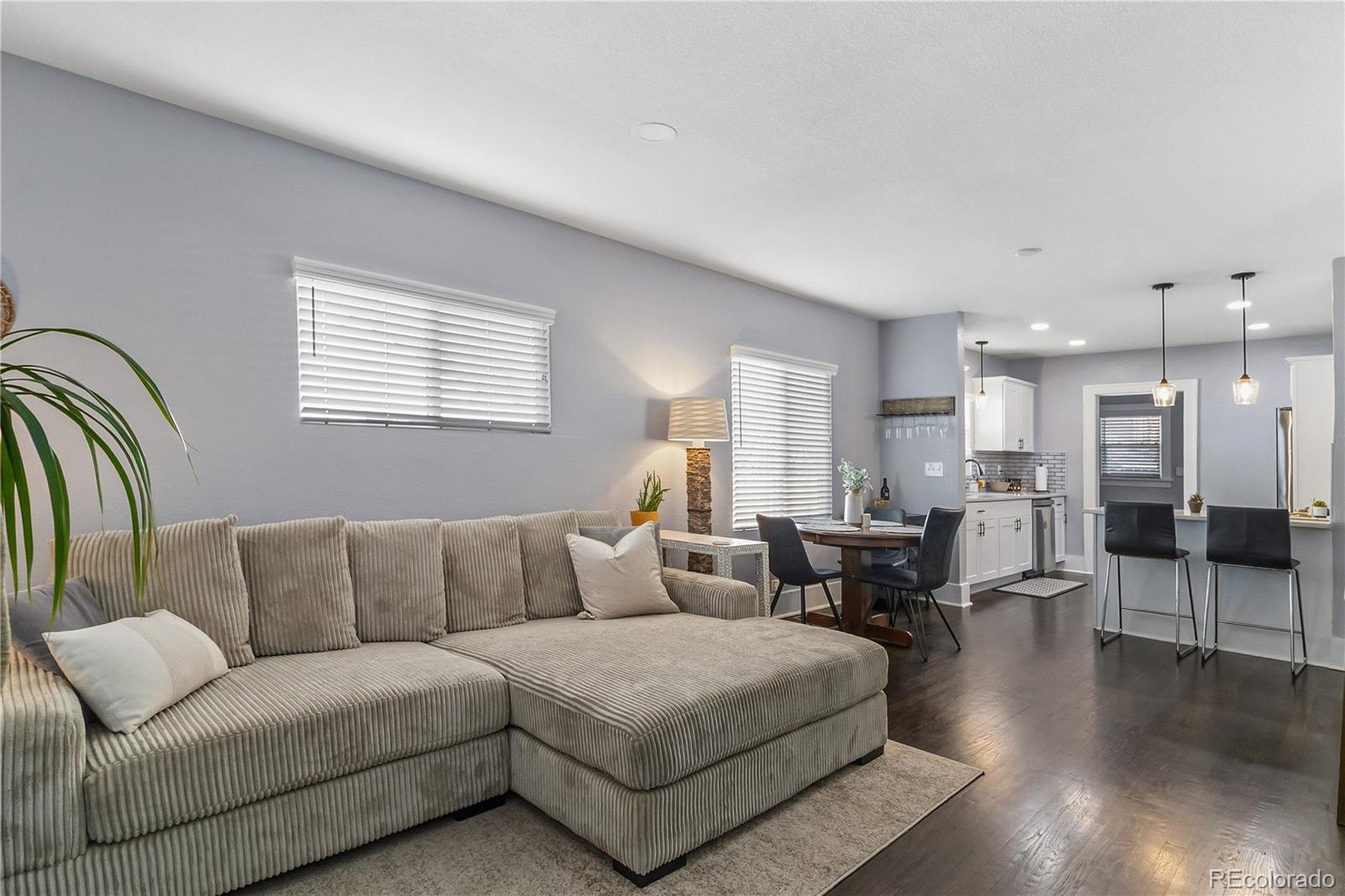 1620 Galena Street Aurora, CO 80010 - Photo 8 of 31 a living room with furniture and wooden floor