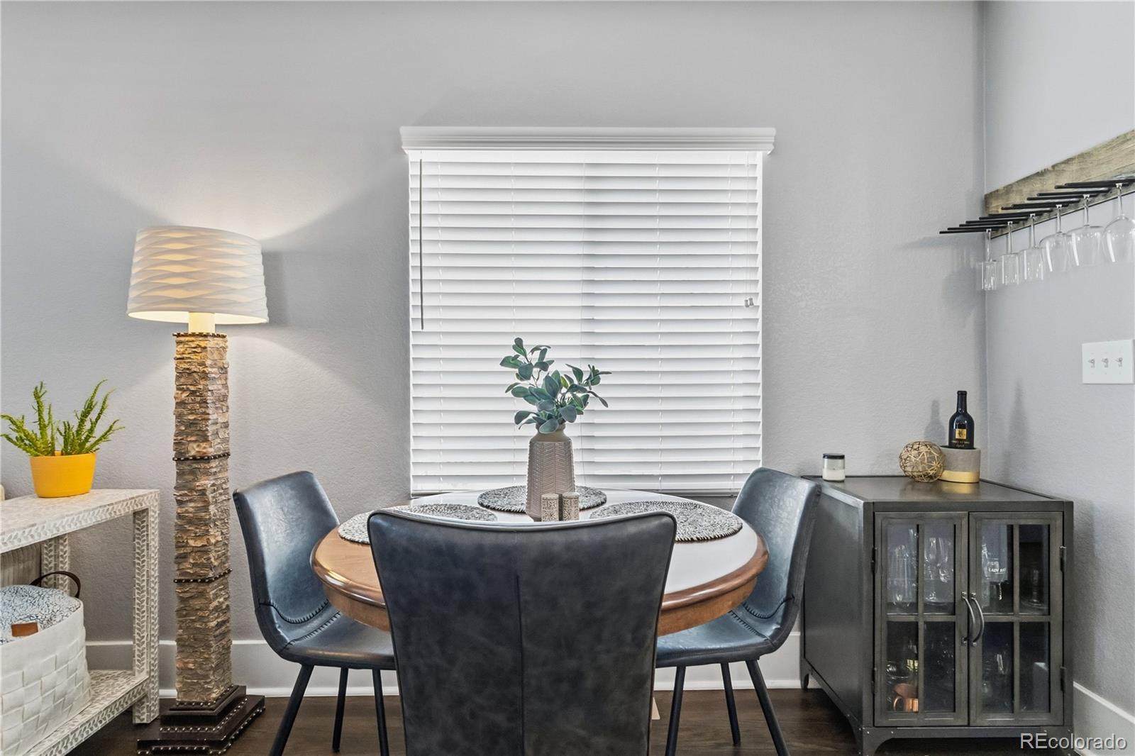 1620 Galena Street Aurora, CO 80010 - Photo 9 of 34 a dining room with furniture and wooden floor