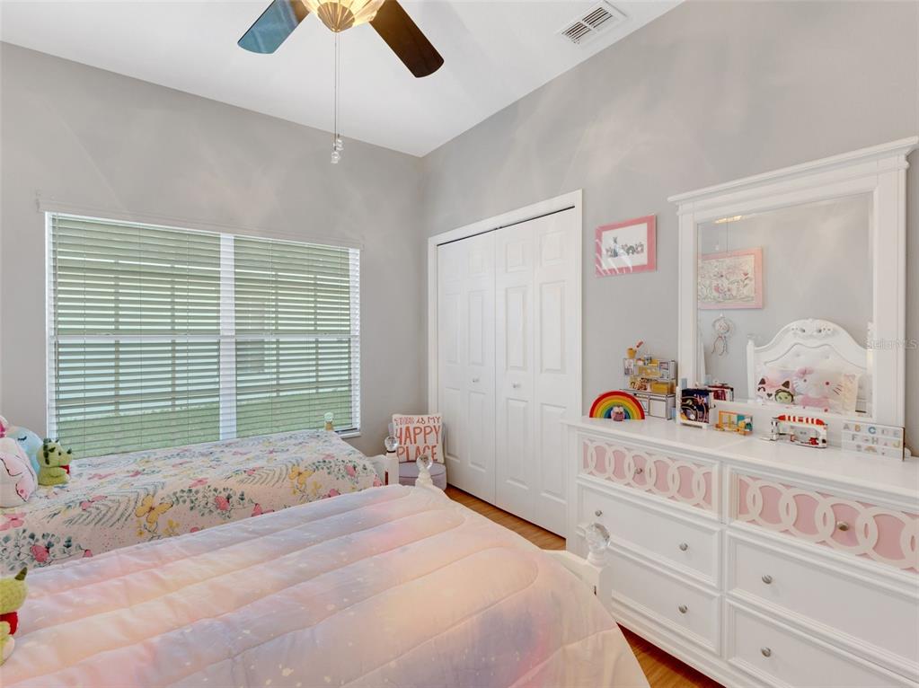 411 Ridge View Drive Davenport, FL 33837 - Photo 12 of 24 a bedroom with a bed and a window