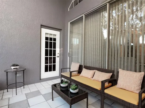 a outdoor living space with furniture and a potted plant