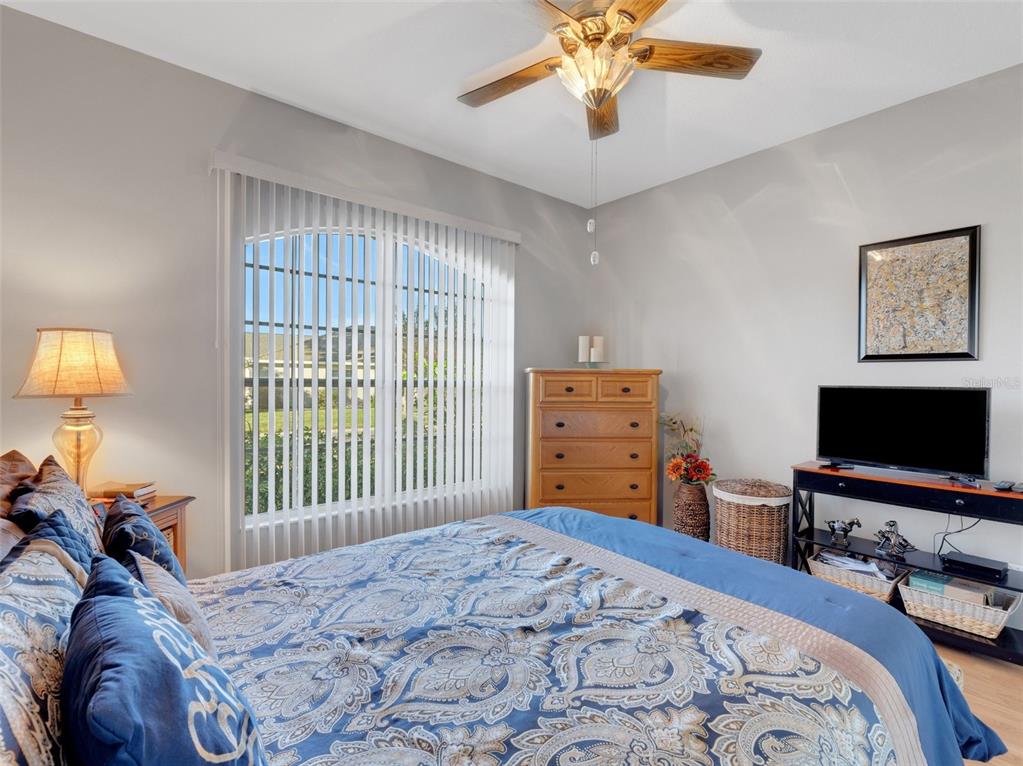 411 Ridge View Drive Davenport, FL 33837 - Photo 6 of 24 a bedroom with a bed and a flat screen tv