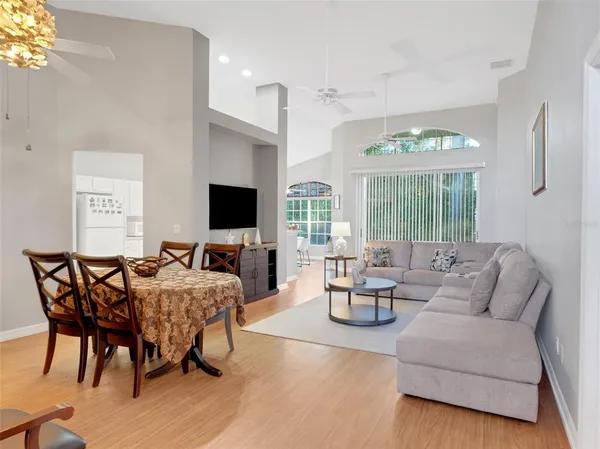 a living room with fireplace furniture and a flat screen tv