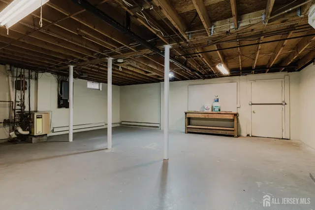 a view of empty room with wooden ceiling