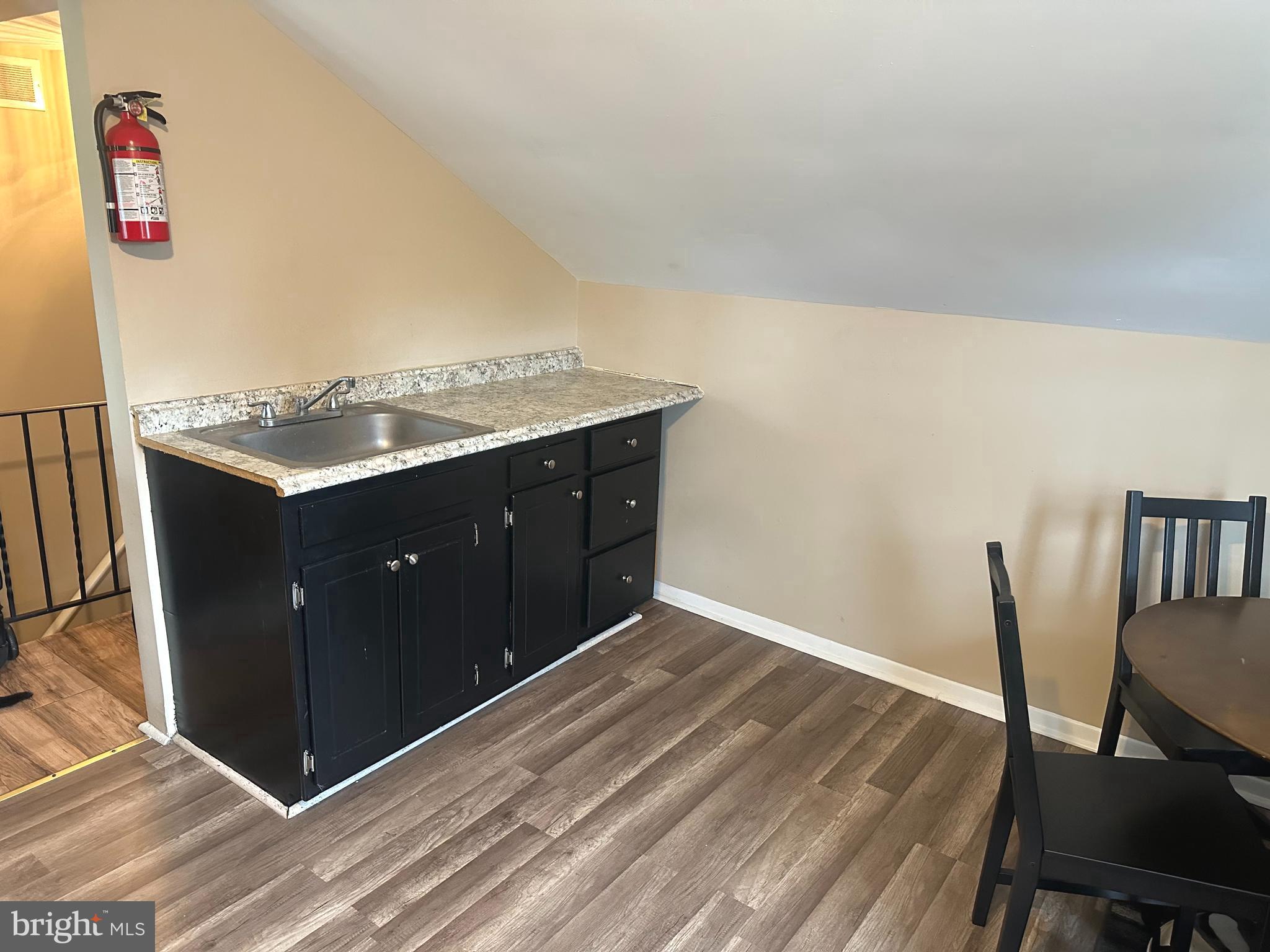 911 Laurel Road Lindenwold, NJ 08021 - Photo 11 of 20 a room with a wooden floor and furniture