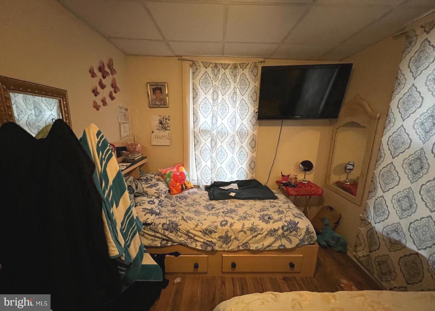 911 Laurel Road Lindenwold, NJ 08021 - Photo 15 of 20 a bedroom with a bed window and flat screen tv