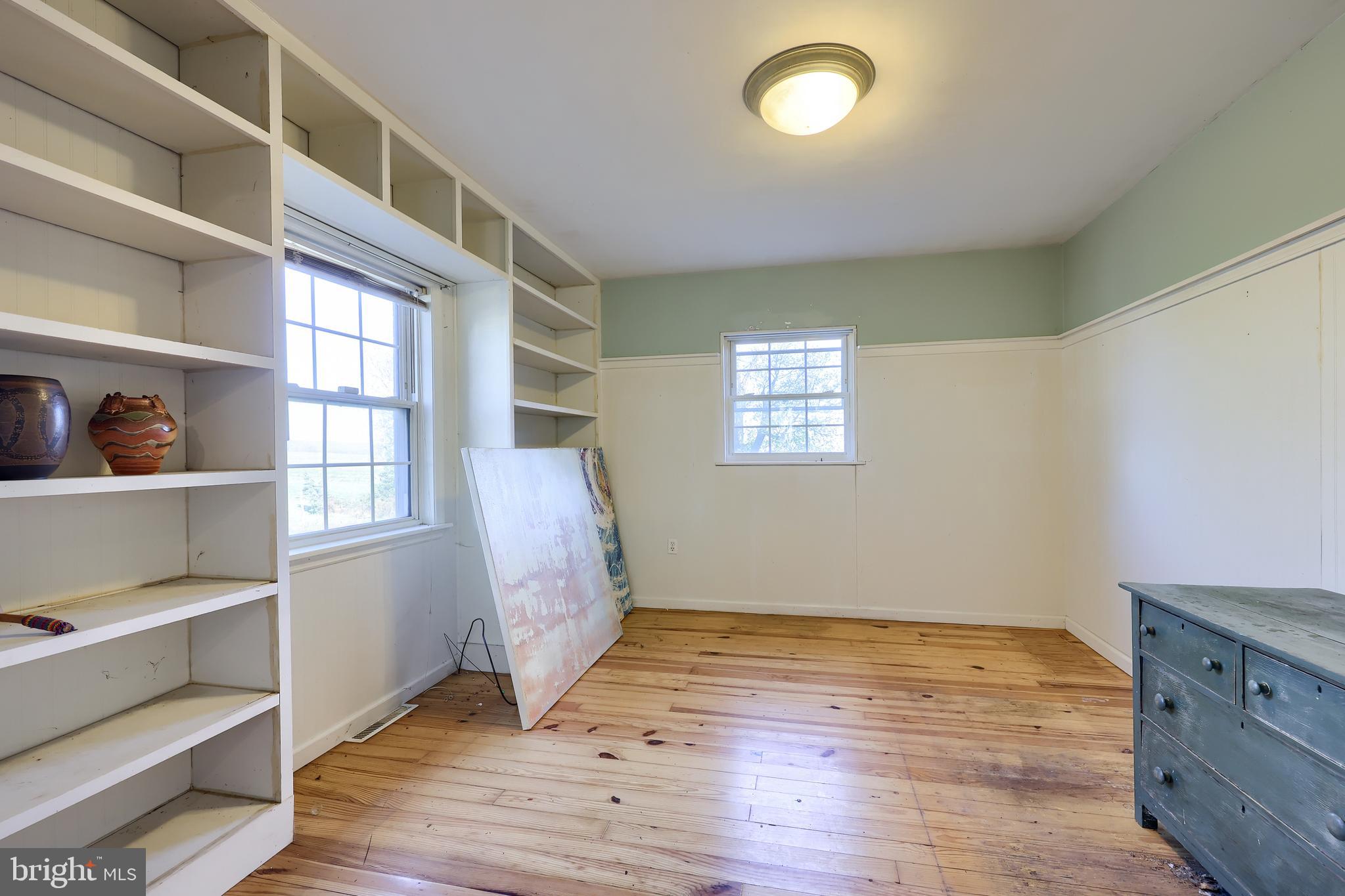 351 East Lexington Road Lititz, PA 17543 - Photo 13 of 36 a view of empty room with wooden floor and fan