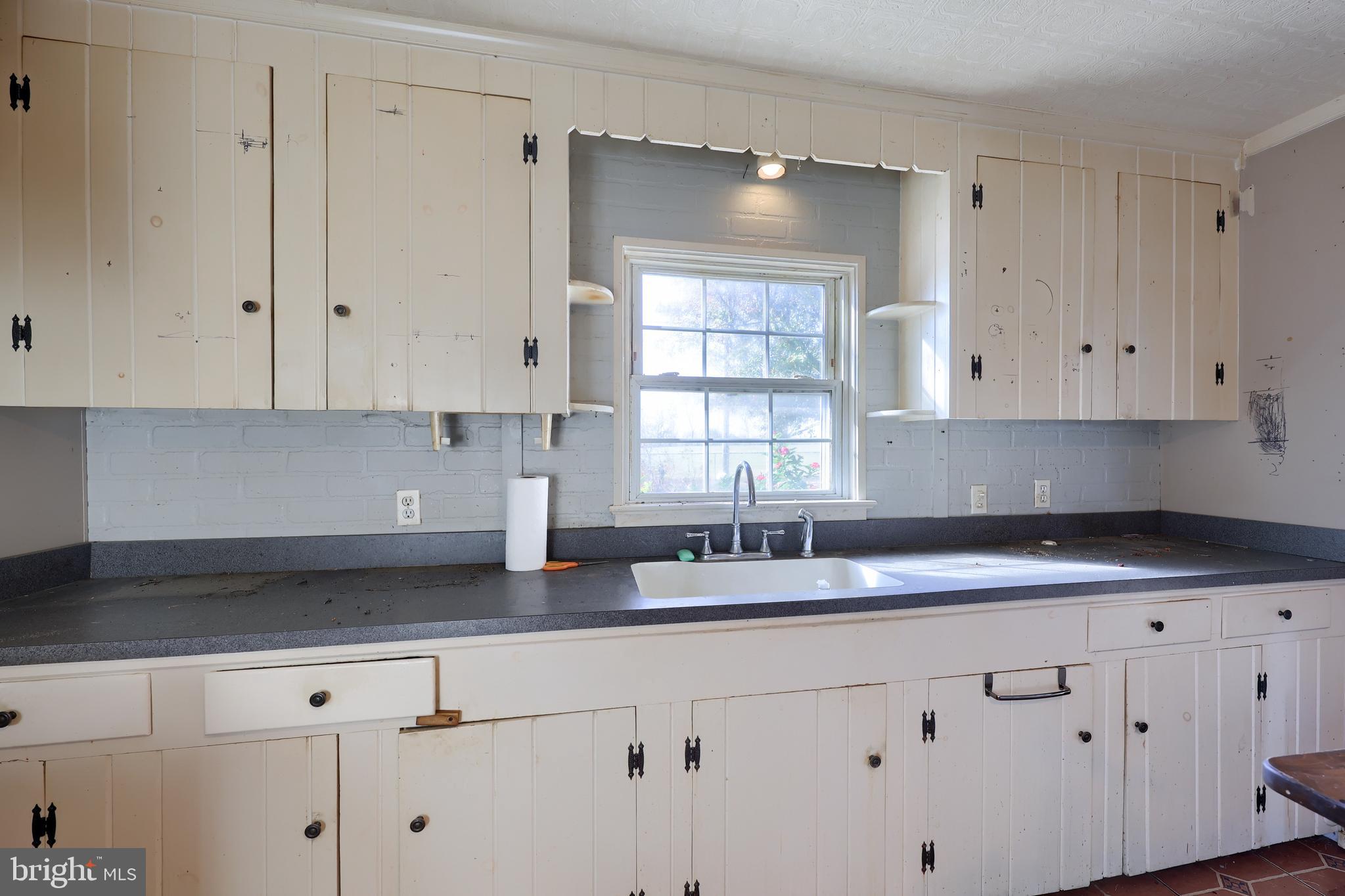 351 East Lexington Road Lititz, PA 17543 - Photo 16 of 36 a kitchen with granite countertop white cabinets and white stainless steel appliances