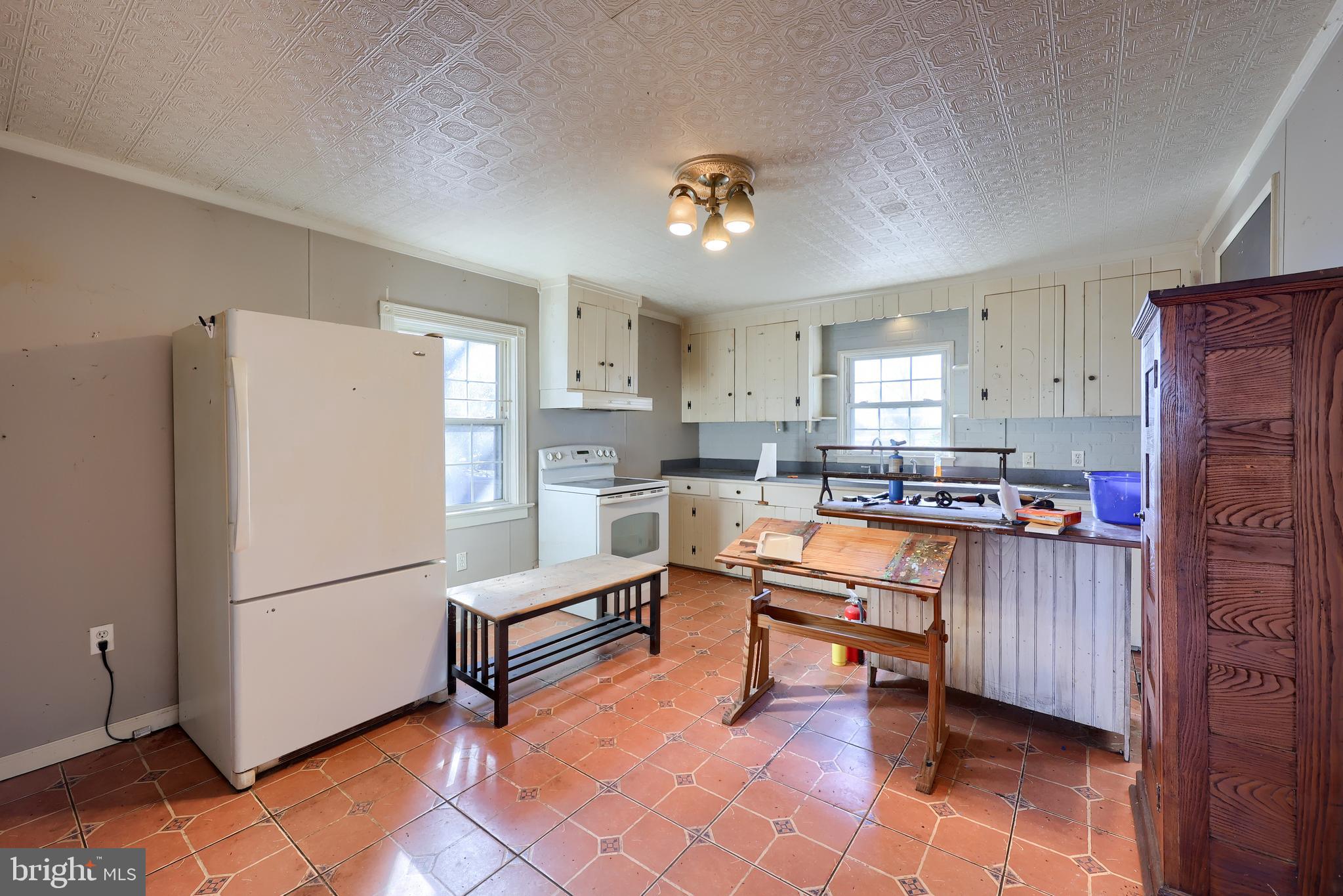351 East Lexington Road Lititz, PA 17543 - Photo 19 of 36 a kitchen with stainless steel appliances granite countertop a refrigerator and a stove top oven