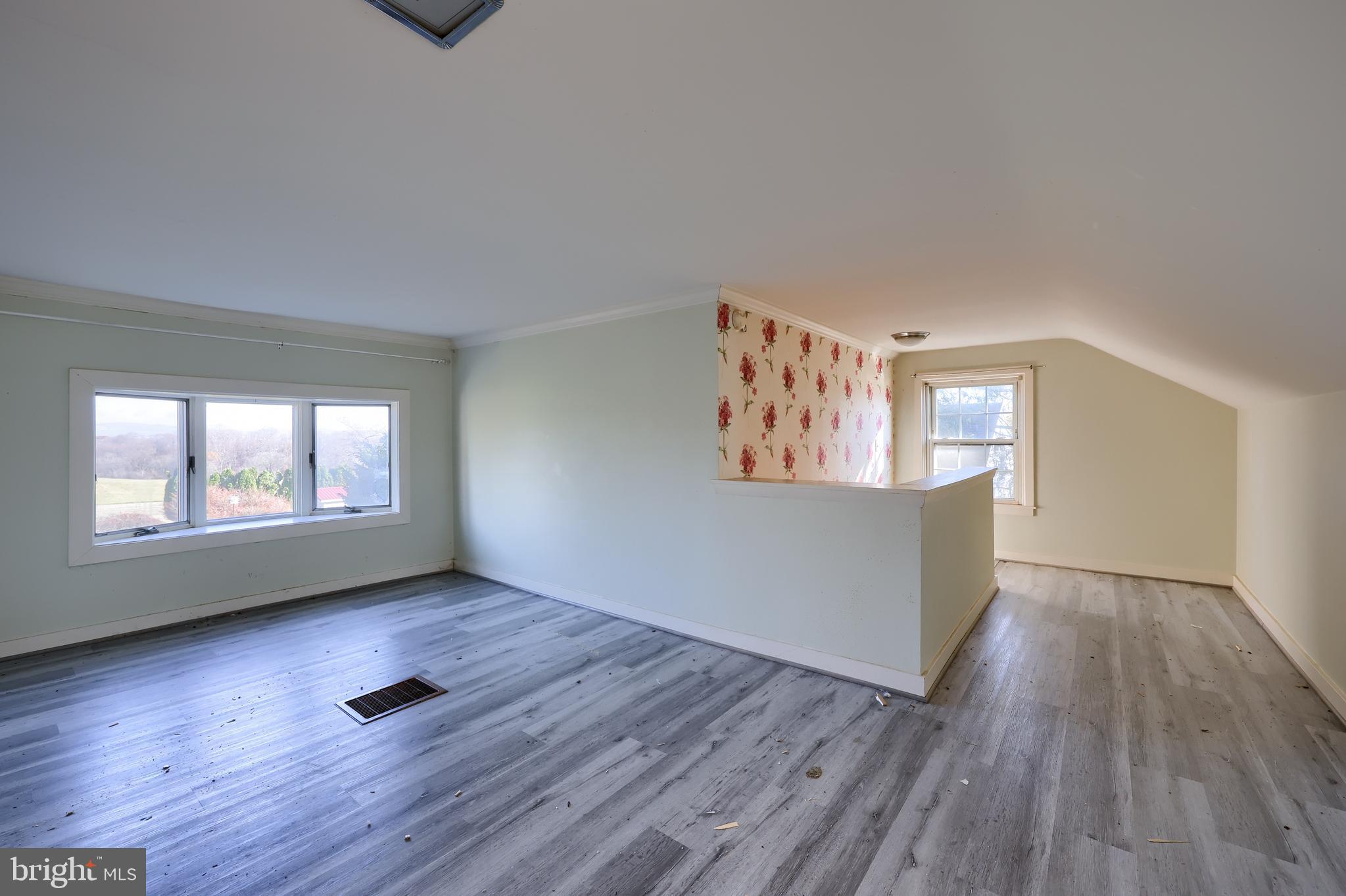 351 East Lexington Road Lititz, PA 17543 - Photo 23 of 36 an empty room with wooden floor and windows
