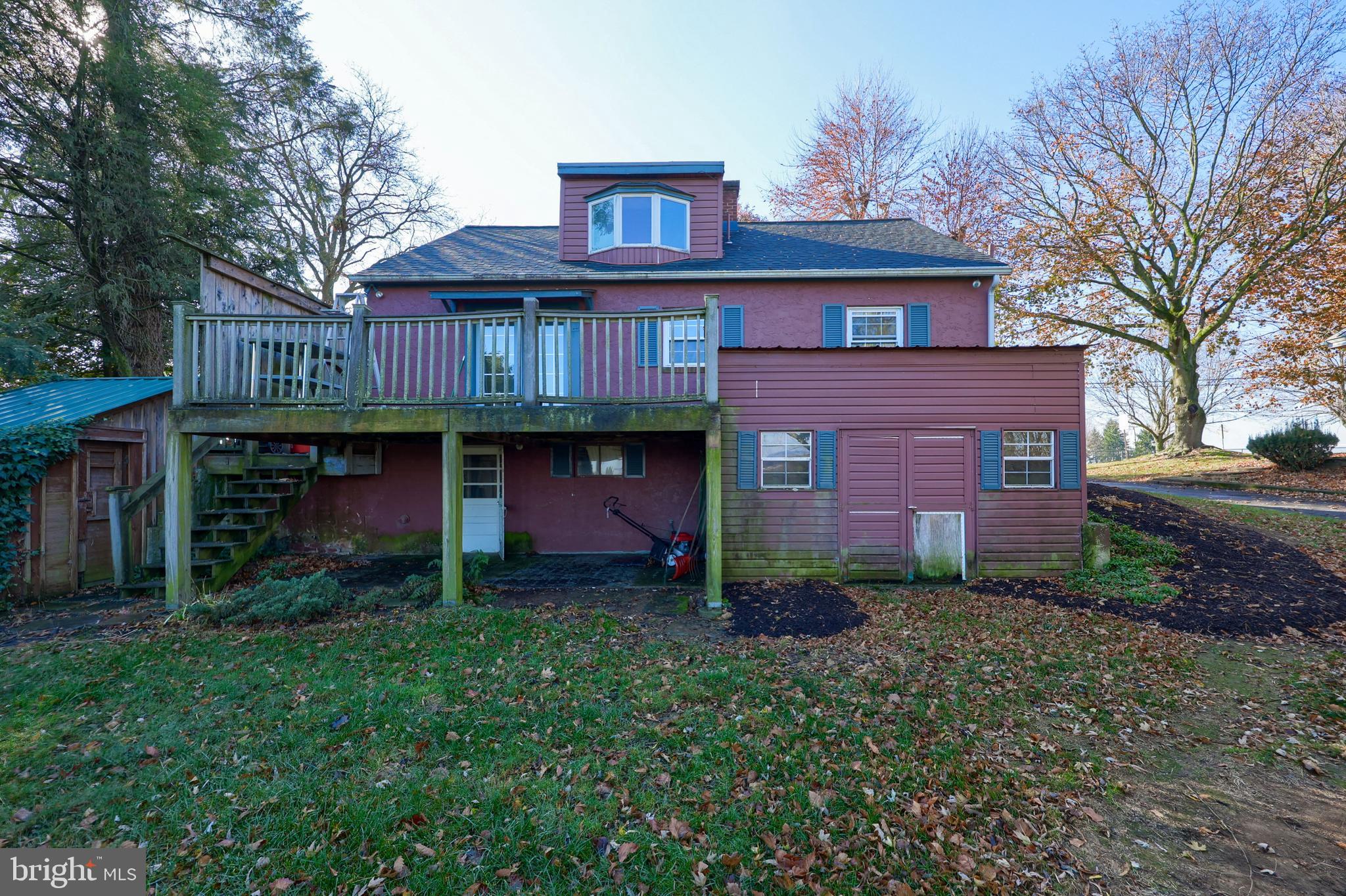 351 East Lexington Road Lititz, PA 17543 - Photo 35 of 36 a view of a brick house with a small yard and large tree