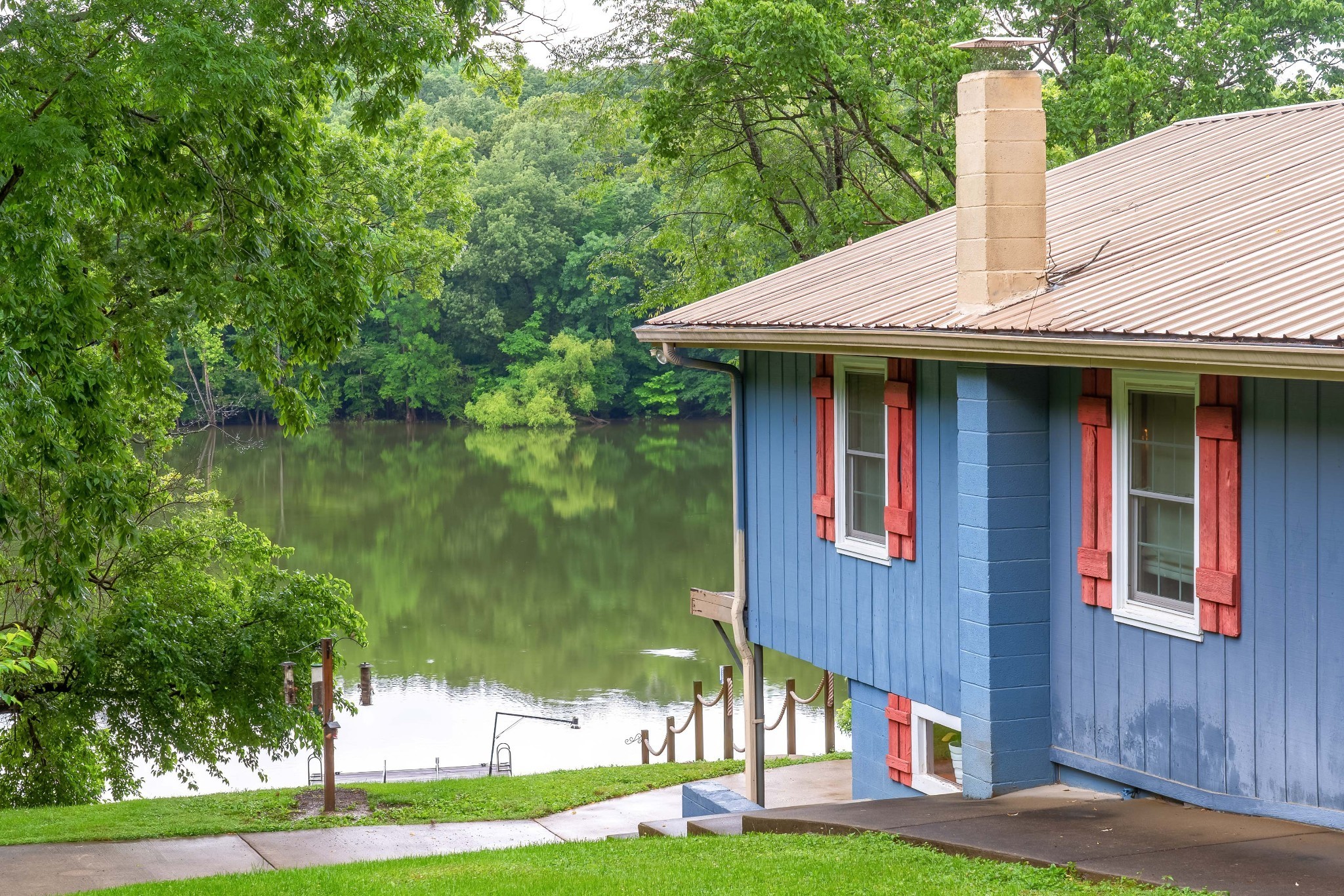 554 Hickman Shores Road Dover, TN 37058 - Photo 7 of 93 a front view of a house with garden