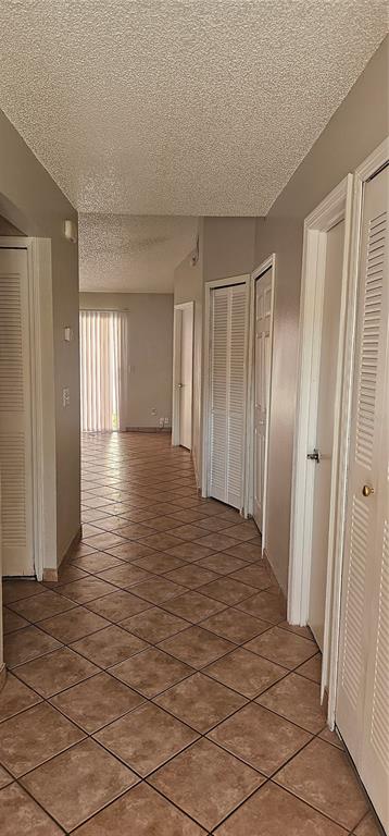 805 Victoria Boulevard Kissimmee, FL 34741 - Photo 14 of 14 a view of a room with wooden floor and stairs