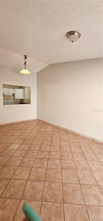 805 Victoria Boulevard Kissimmee, FL 34741 - Photo 6 of 14 a view of an empty room and window