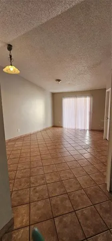 a kitchen with cabinets and white appliances