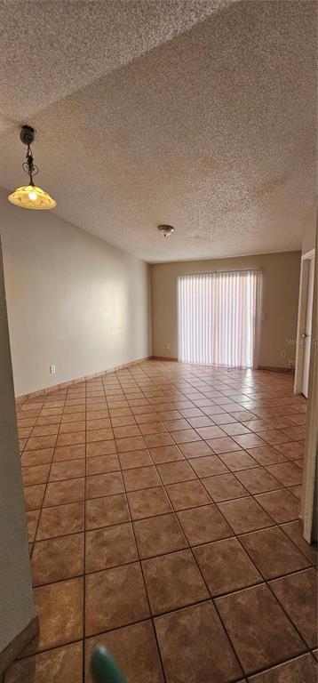 805 Victoria Boulevard Kissimmee, FL 34741 - Photo 7 of 14 a view of an empty room and window