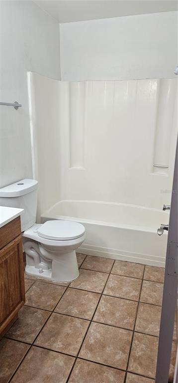 805 Victoria Boulevard Kissimmee, FL 34741 - Photo 10 of 14 a bathroom with a toilet a sink and a shower