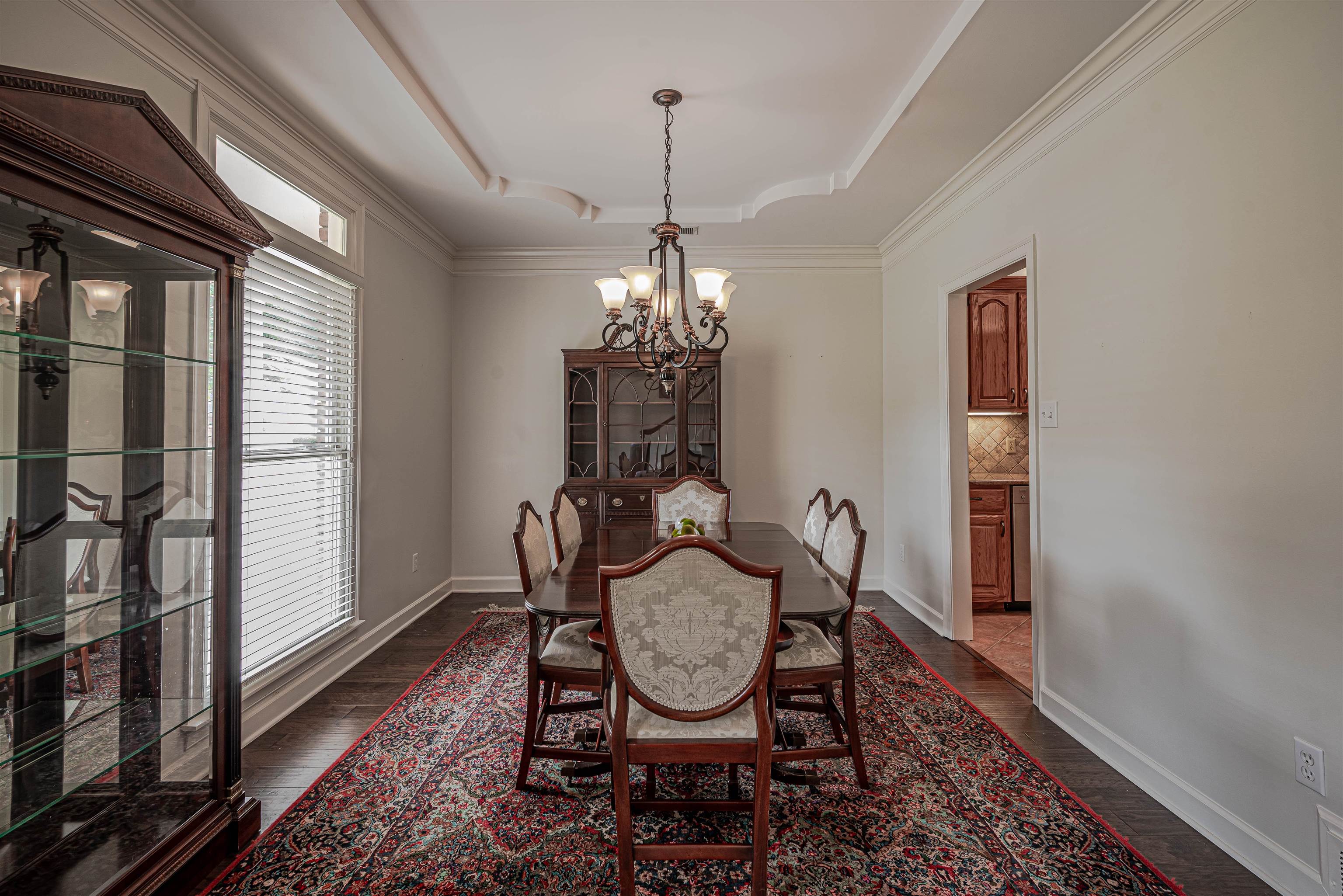 752 Gable Lane Collierville, TN 38017 - Photo 13 of 40 a room with chandelier fan and wooden floor