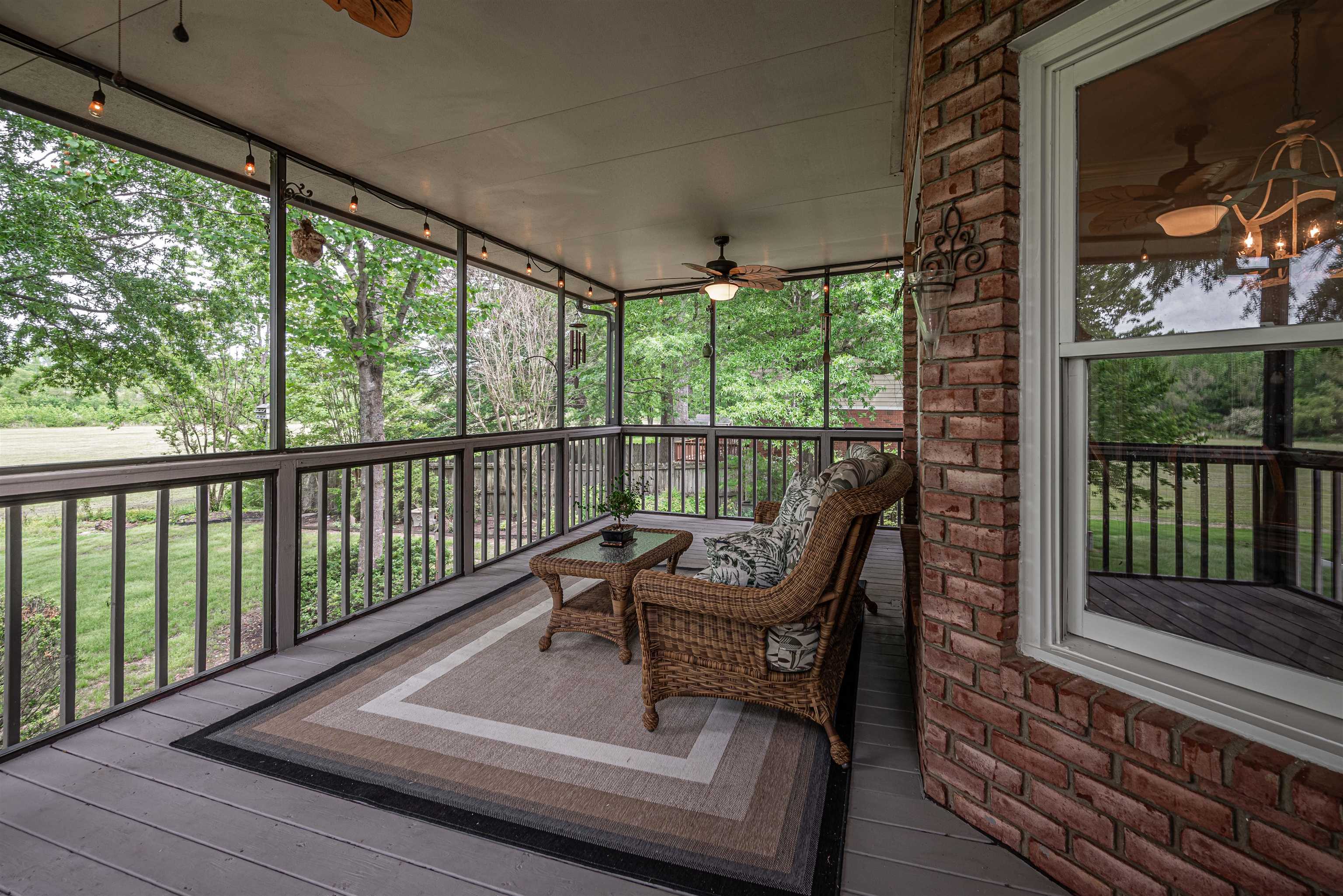 752 Gable Lane Collierville, TN 38017 - Photo 16 of 40 a roof deck with table and chairs and wooden floor