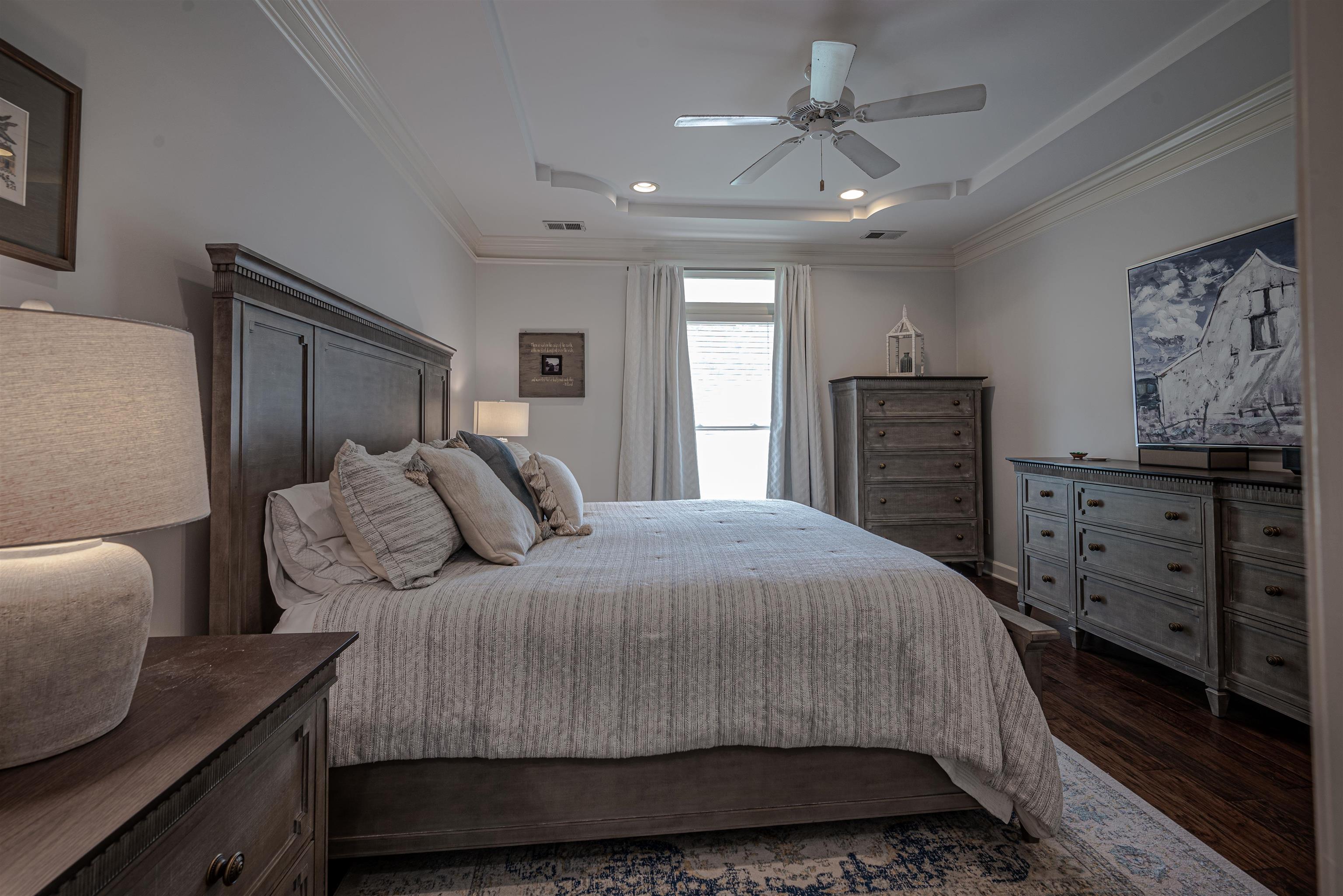 752 Gable Lane Collierville, TN 38017 - Photo 19 of 40 a bedroom with a bed and a dresser