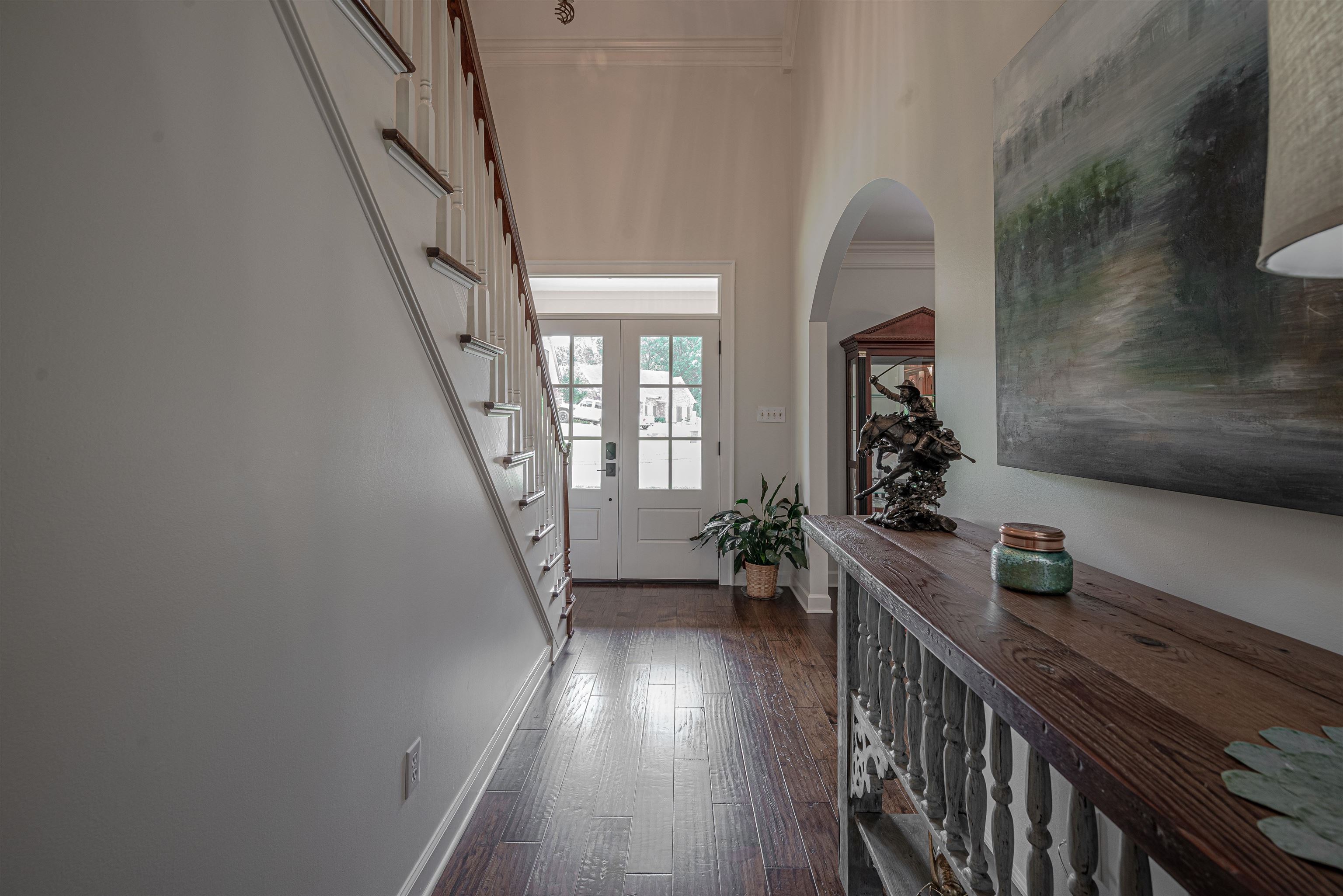 752 Gable Lane Collierville, TN 38017 - Photo 26 of 40 a hallway with wooden floor and furniture