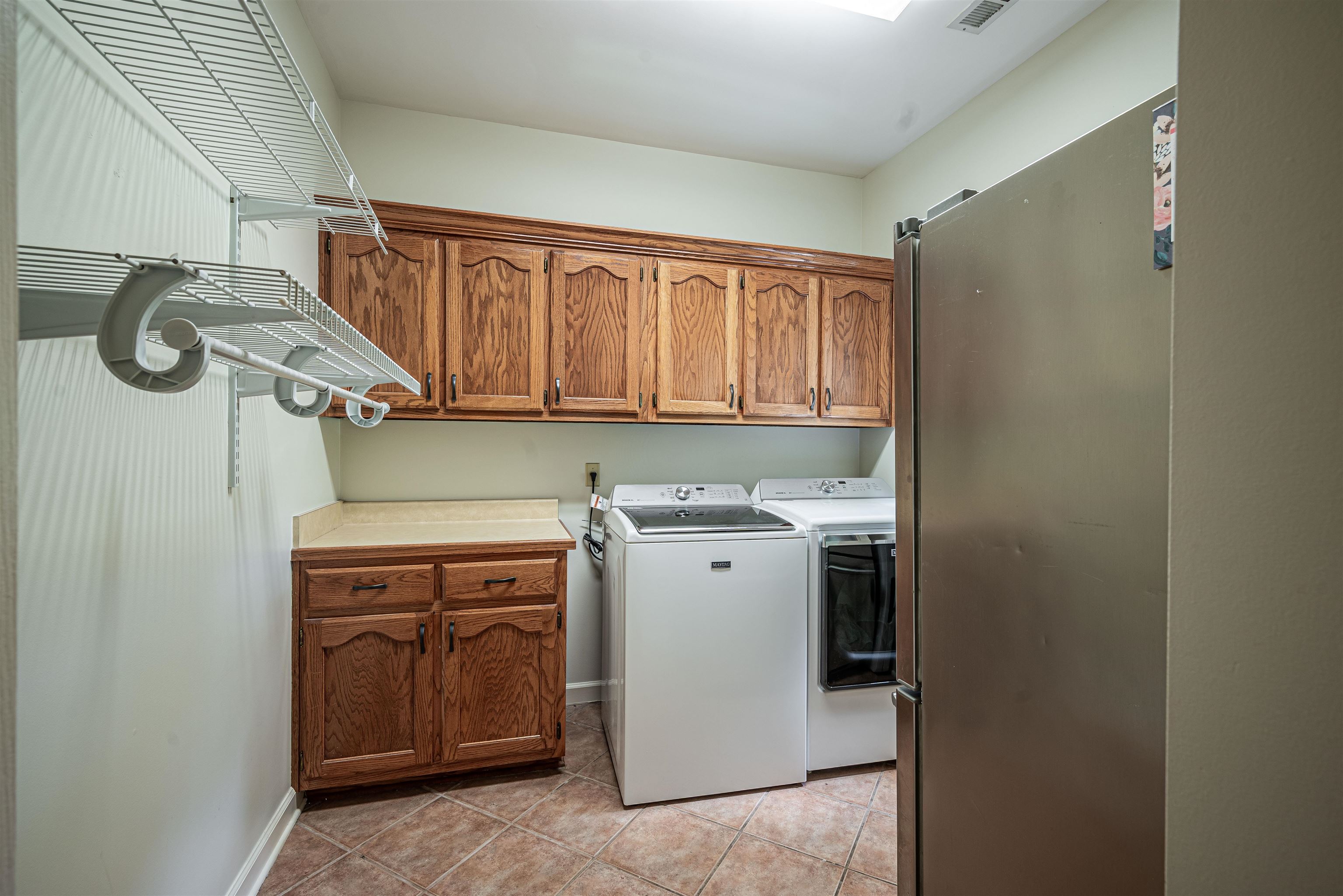 752 Gable Lane Collierville, TN 38017 - Photo 27 of 40 a utility room with sink dryer and washer