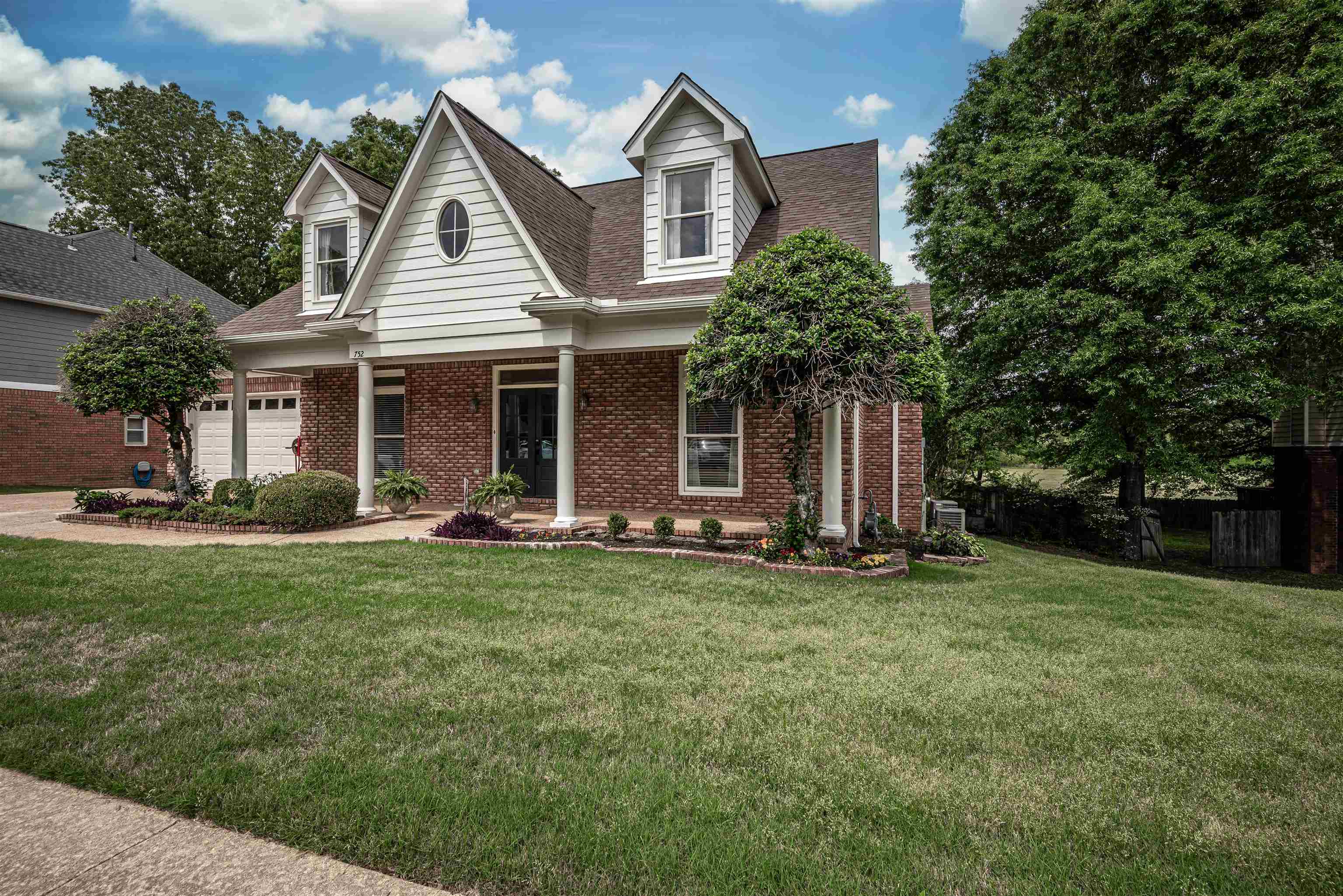 752 Gable Lane Collierville, TN 38017 - Photo 40 of 40 a view of a house with a yard and sitting area