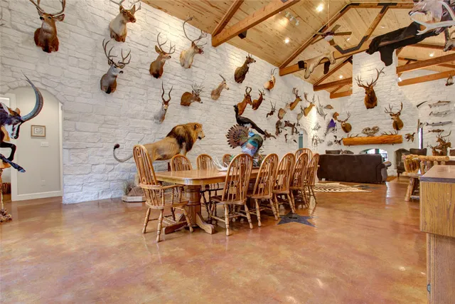 a dining room with furniture and wooden floor