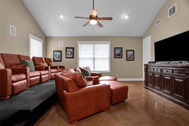 a bathroom with a toilet a sink and a mirror