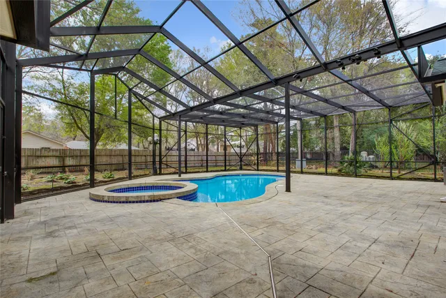 a view of indoor pool and deck