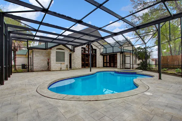 a view of swimming pool with a yard