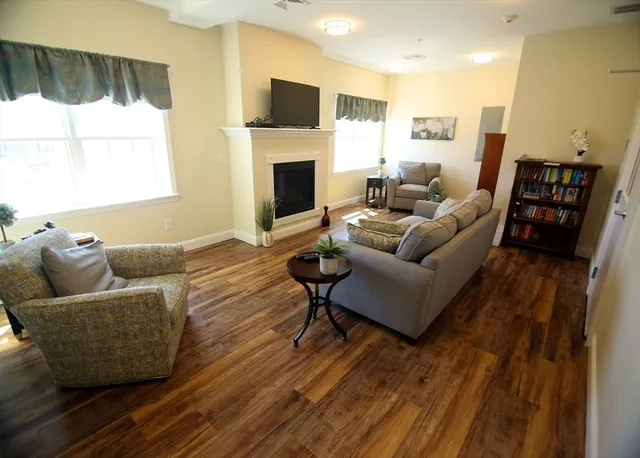 a living room with furniture and a fireplace