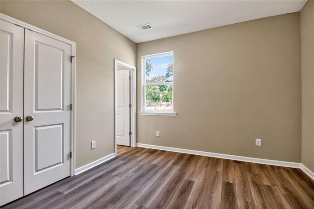 103 Gnome Court Perry, GA 31069 - Photo 11 of 30 a view of room with window and hardwood floor