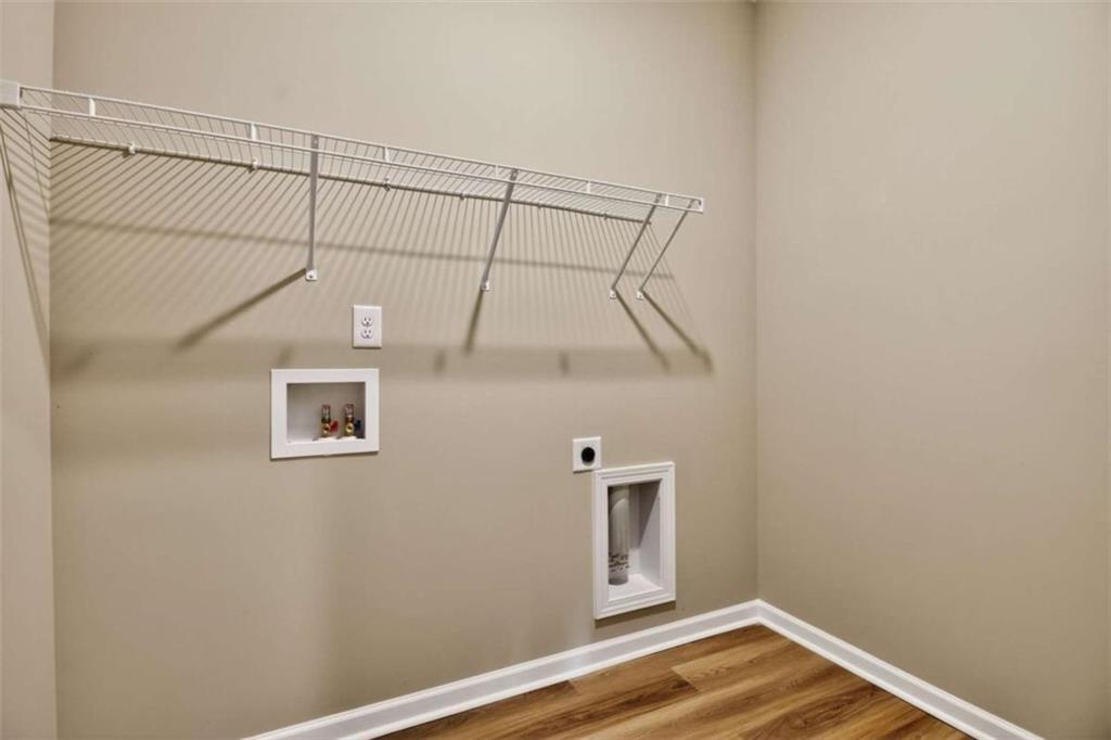 103 Gnome Court Perry, GA 31069 - Photo 12 of 30 a view of a room with a hanging light and hardwood floor