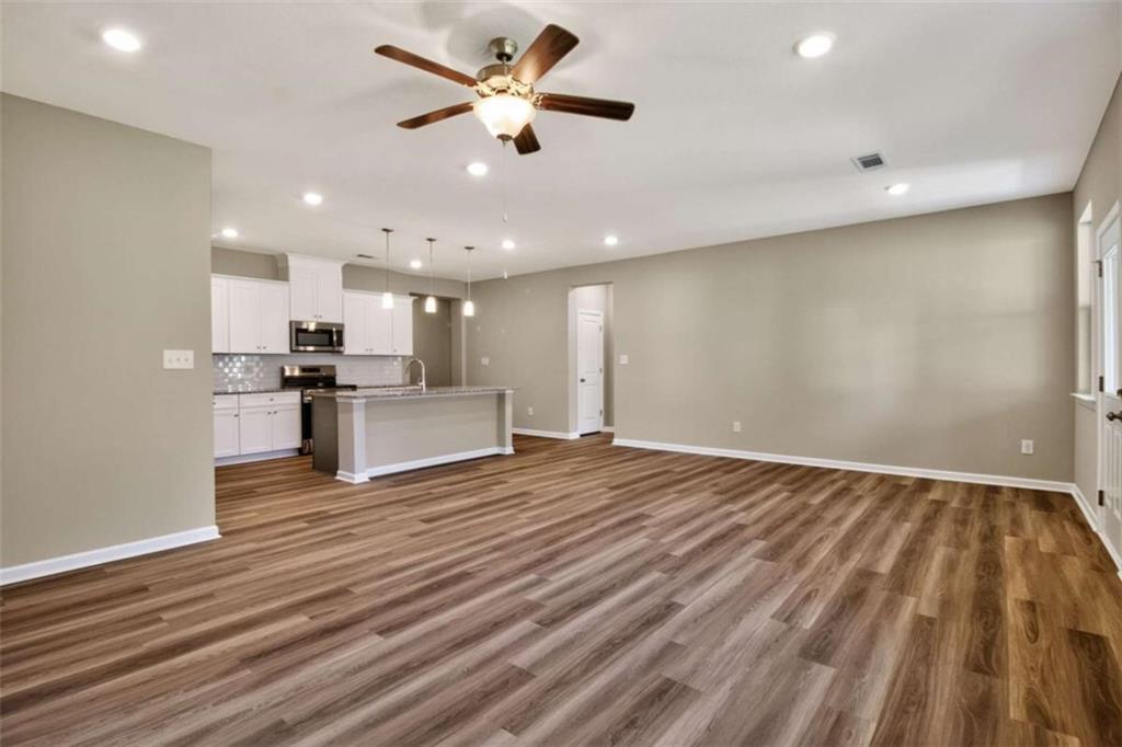 103 Gnome Court Perry, GA 31069 - Photo 14 of 30 a view of kitchen with cabinets appliances and wooden floor