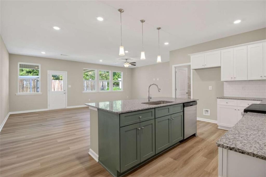 103 Gnome Court Perry, GA 31069 - Photo 19 of 30 a kitchen with a sink wooden floor and window