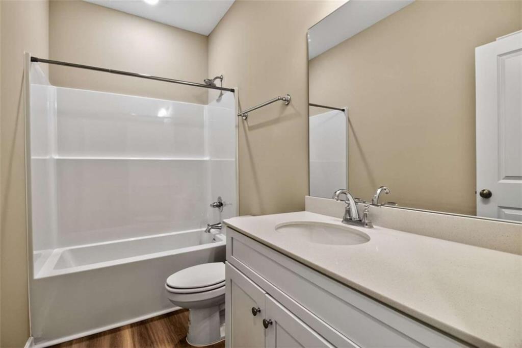 103 Gnome Court Perry, GA 31069 - Photo 22 of 30 a bathroom with a sink a toilet and a mirror