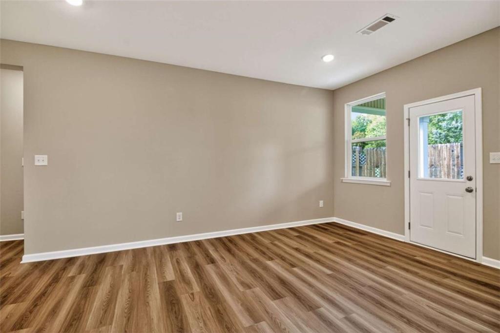 103 Gnome Court Perry, GA 31069 - Photo 27 of 30 a view of an empty room with wooden floor and a window